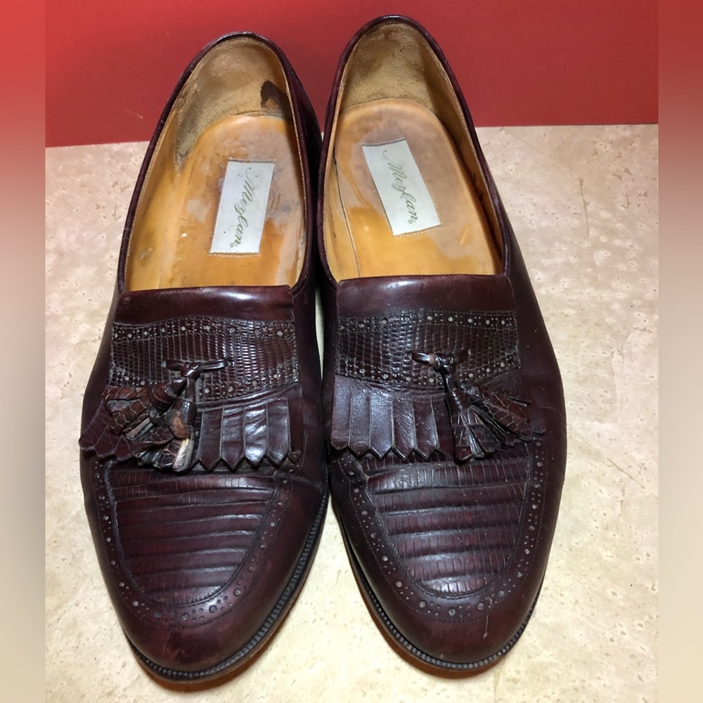 Brown/ cordovan loafers. Median with tassel and fringe.
